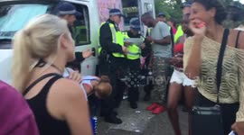 Newsflare Edit - Women 'dance' on policeman at Notting Hill Carnival