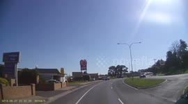 Car swerves towards truck to miss another car instead of braking.