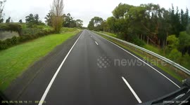 Taxi overtaking turning truck on highway
