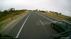 Cars overtaking truck at end of overtaking lane