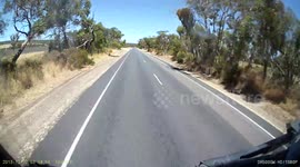 Car overtaking a B-Double with little room to spare