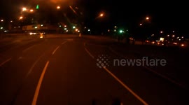 Cyclist slaps thugs trying to grab him.