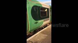 Newsflare Edit - People squashed against windows on overcrowded Southern Rail train