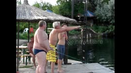 Jumping into the water through an inflatable barrel