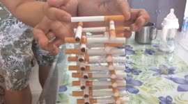 Man builds tower out of dozens of cigarettes