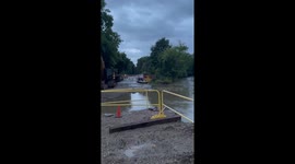 Floodwaters rush through Wisconsin Ave in Wauwatosa, Wisconsin , USA