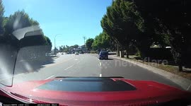 Dash cam captures a car running a red light and the ensuing crash.
