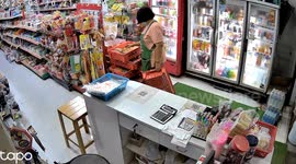 Shopkeeper narrowly avoids being crushed when drinks fridge topples over