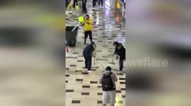 Airport staff remove floodwater amid heavy rain in Mexico City