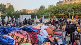 Police evacuate migrant camp outside Paris City Hall amid heatwave