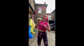 Woman Spins Hula Hoop On Breasts