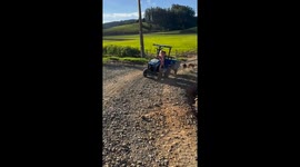 Young girl skillfully drives tractor in Taió, Brazil