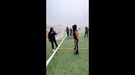 Shoulder ride mishap on football field in Curauma, Chile