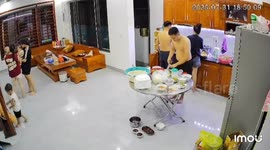 Child accidentally spills food while walking backward in Quảng Ninh, Vietnam