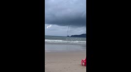 Waterspout tornado swirls across horizon on Thai island Phuket