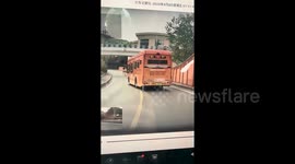 Worker nearly thrown from boom lift after bus crashes into construction vehicle in China