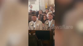 Moment christening guests realise they are attending surprise wedding
