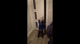 Woman in elf costume tries to surprise her daughter after Christmas work but fails