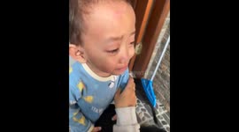 Little boy pauses crying to sing with sibling in Jakarta, Indonesia