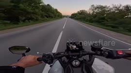 Motorcyclist narrowly avoids collision with tractor in Kharkiv Oblast, Ukraine