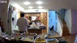 Woman tried to move the table but it toppled and food fell forward