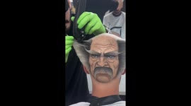 Barber Shaves Human Face Design into Man’s Head