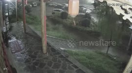 Dozens of parked cars swept into river as heavy rain pounds China