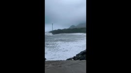 Waves crash into shore as Typhoon Podul reaches southern Taiwan