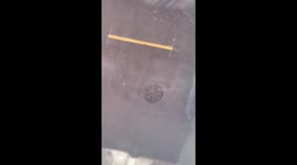 Heavy rain causes manhole water burst in Chicago, Illinois, USA