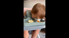 Little girl eats yogurt with her face in the bowl in Yalova, Turkey