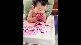 Baby’s eating skills improve from messy hands to neat spoon use in Kuala Lumpur, Malaysia
