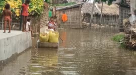 Locals struggle through flooded village as Ganges River bursts its banks in India