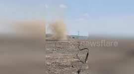 UK: Whirling Dust Devil Swirls Across Holt Heath Caught On Video