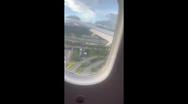 Passengers clap when plane lands safely during typhoon in Taiwan