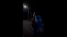 Shark and dinosaur leave Halloween party on a bike together