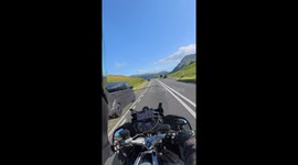 Motorcyclist loses balance and falls on curve in North Wales, UK