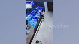 Woman stamps on live fish in fresh seafood market to get discount price