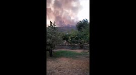 Thick smoke from Jarilla wildfire visible over Jerte River and Valley in Plasencia, Spain