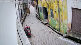 India: Crumbling school structure gives way suddenly, elderly woman survives close brush with falling debris