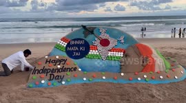 Sand artist makes beach sculpture celebrating India Independence Day