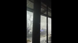 Storm uproots trees and tears down roofs in Manila