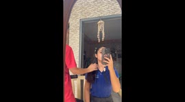 Sibling hair-ironing adventure ends with a surprising and chucklesome slip-up