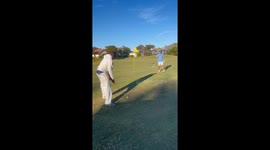Friend Doubts Five Iron on Green