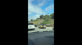 Man Blows Bubbles Out Car Window