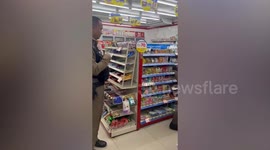 Police chase stray dog out of 7-Eleven convenience store