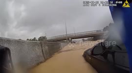 Chattanooga Officer Rescues People, Dog From Flooded Interstate