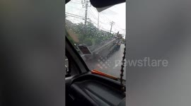 Metal beams fall from truck after it fails to go uphill