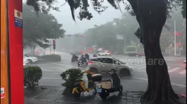 Roof blown by strong wind hits motorcyclist in Guangxi, China