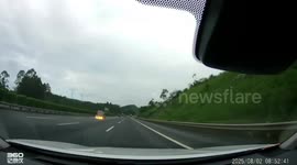 Vehicle rear bursts into flames on road in Guangxi, China