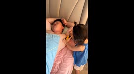 Daughter pranks father with armpit waxing in Jiangsu, China